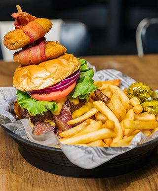 ESPN BET burger with fries and pickles