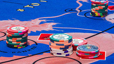 picture of poker chips on a baccarat table