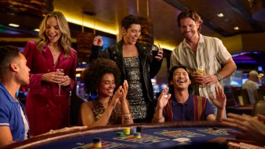 Group at a table game playing